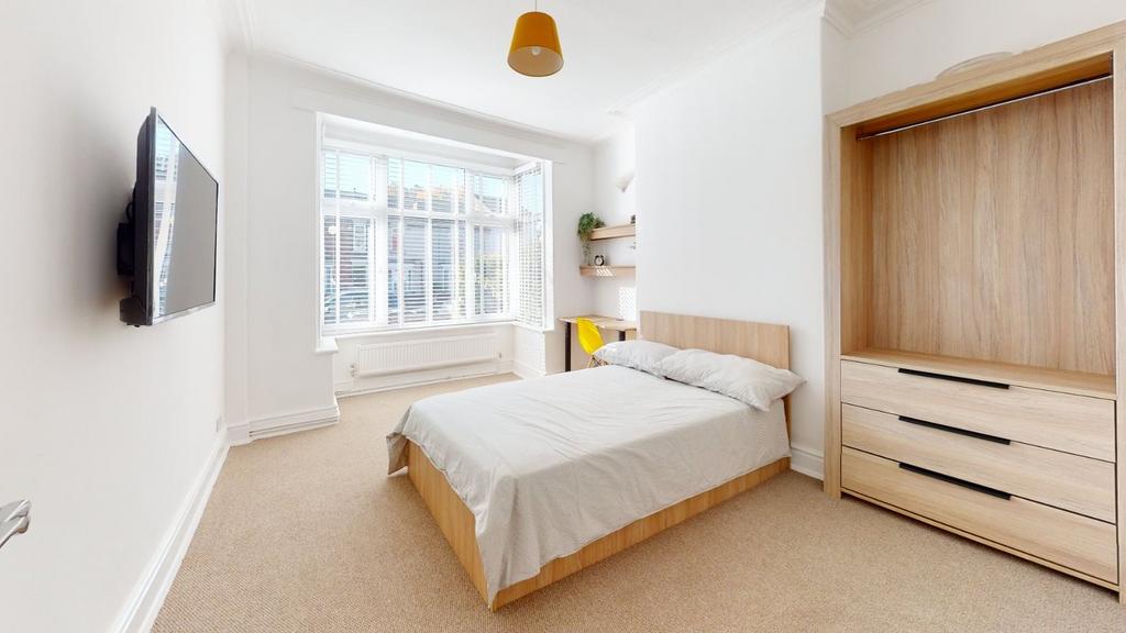 Bright and inviting single bedroom featuring a ...