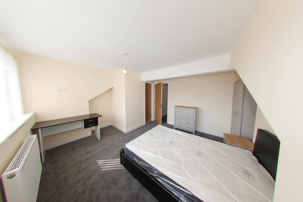 A bright and spacious master bedroom featuring ...