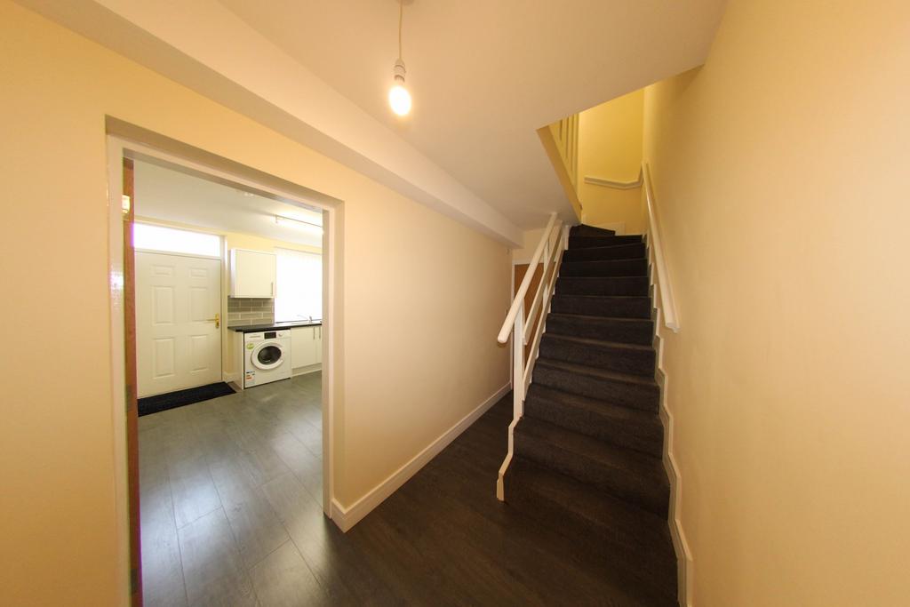 Bright, freshly painted entrance hallway with m...