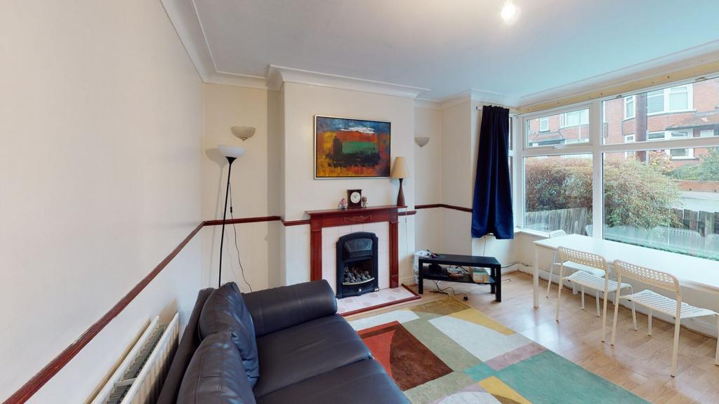 A bright and welcoming living room with large w...
