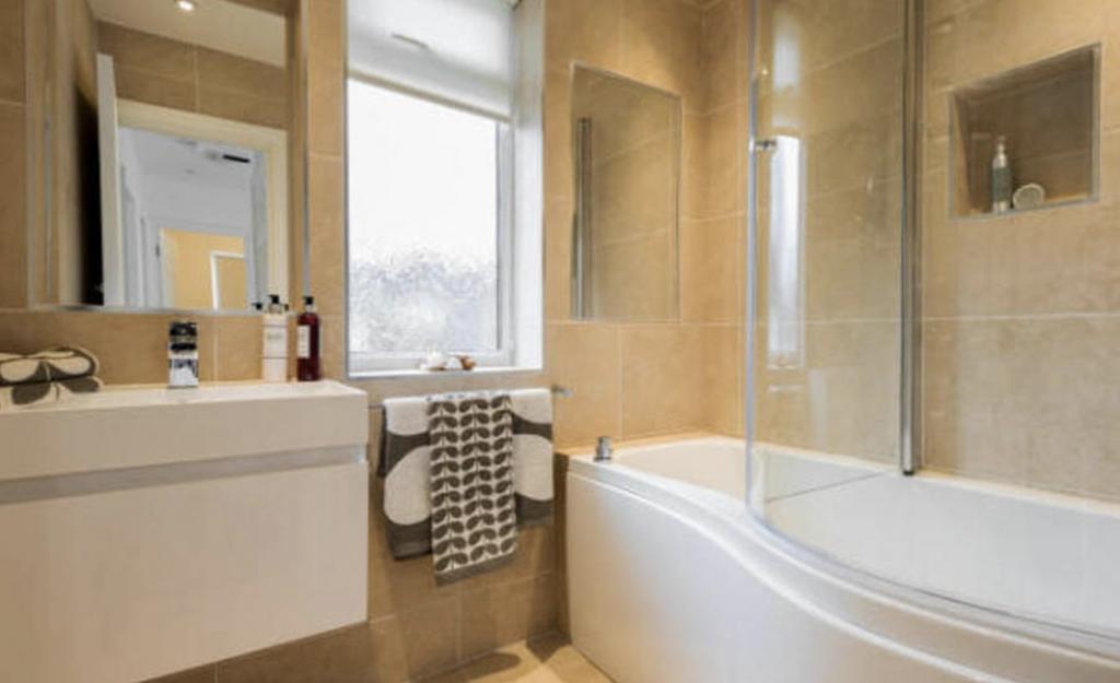A modern, well-maintained bathroom featuring a ...