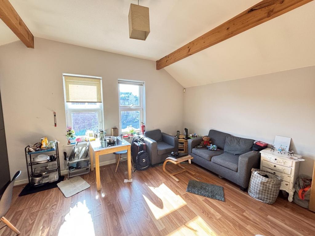 Bright and welcoming living room featuring comf...