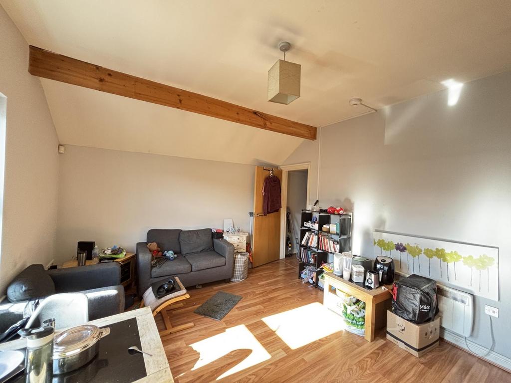 Bright and spacious living room with abundant n...