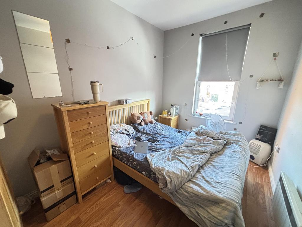 A bright and spacious master bedroom featuring ...