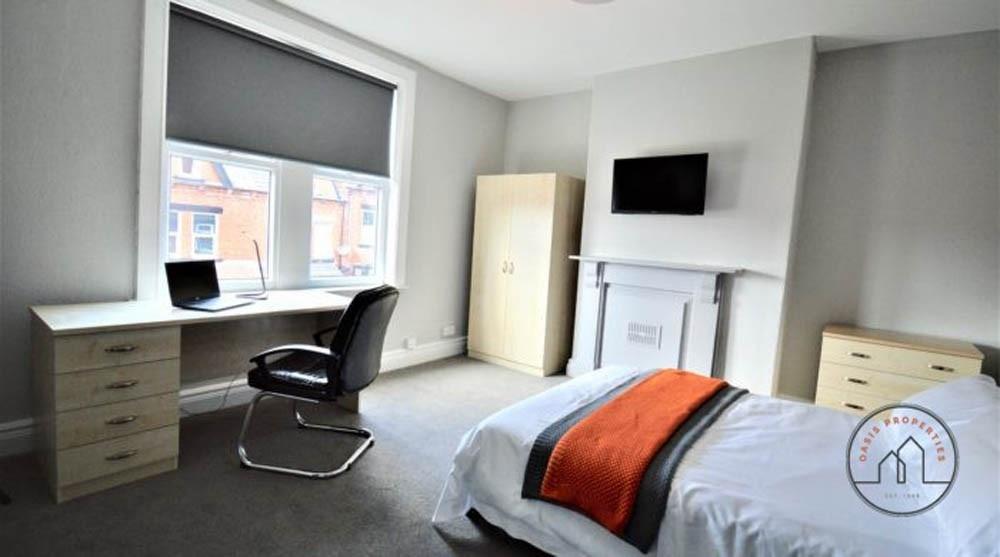 A bright and modern bedroom featuring a comfort...