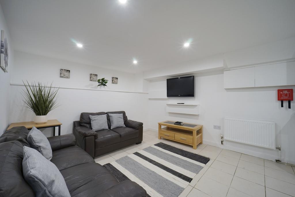 Bright and spacious living room featuring moder...