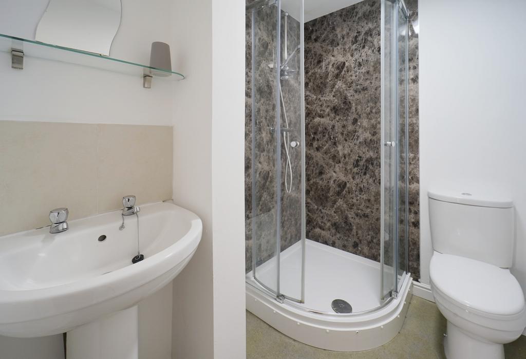 A clean and well-maintained bathroom featuring ...