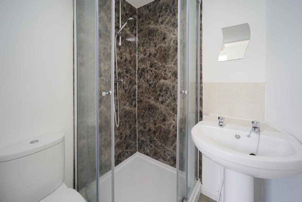 A clean and well-maintained bathroom featuring ...