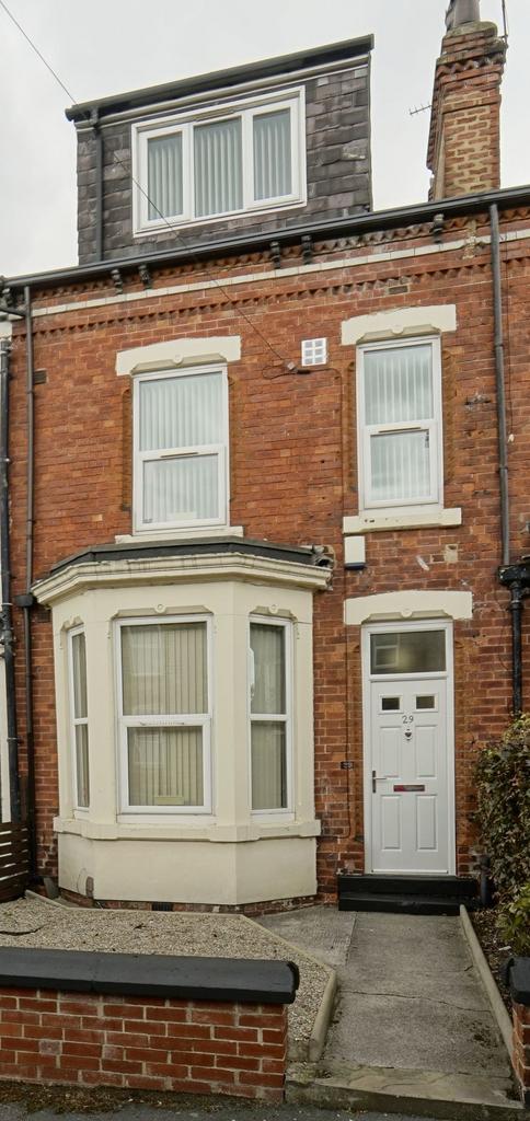 Exterior view of a charming brick house with a ...
