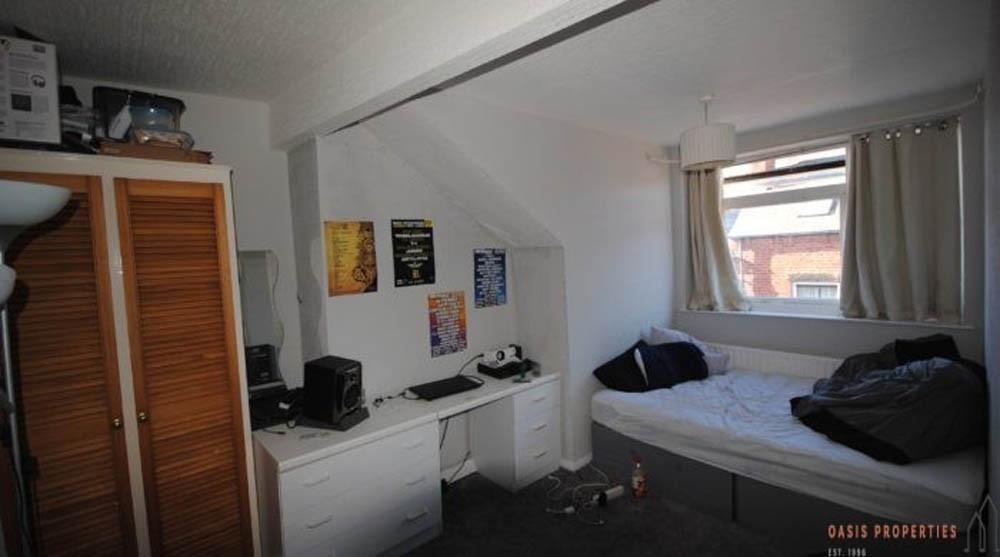 A cozy bedroom with a comfortable bed and ample...