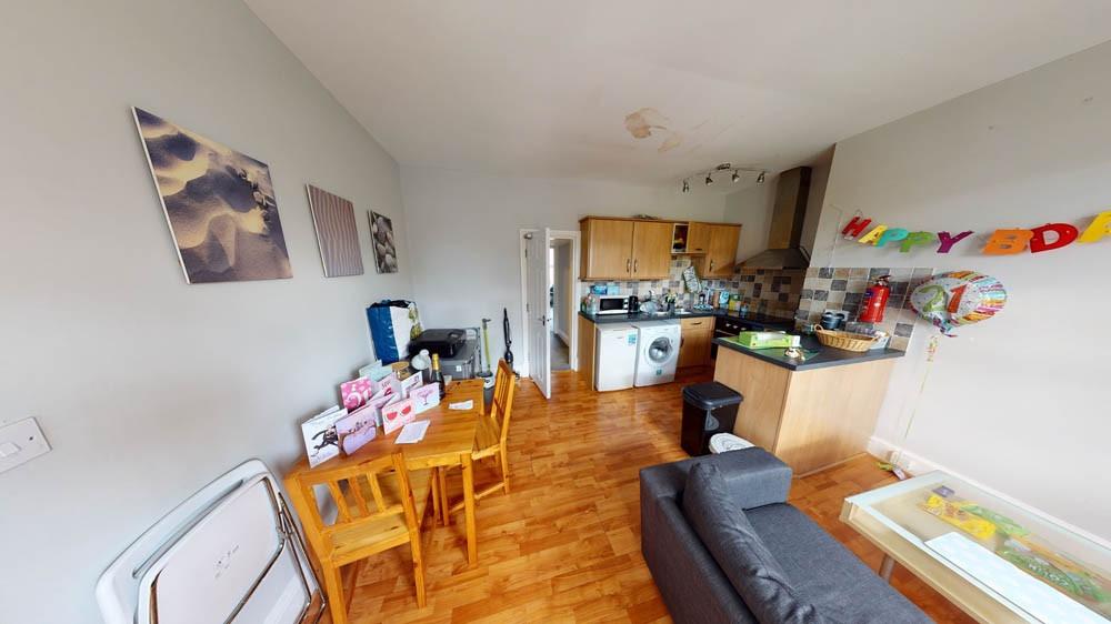 A bright and welcoming living room featuring co...