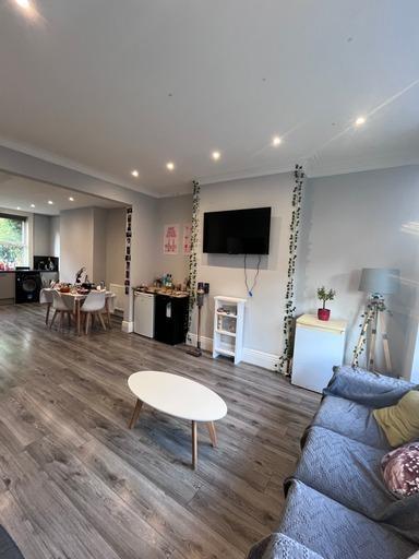 A spacious and modern living room with ample na...