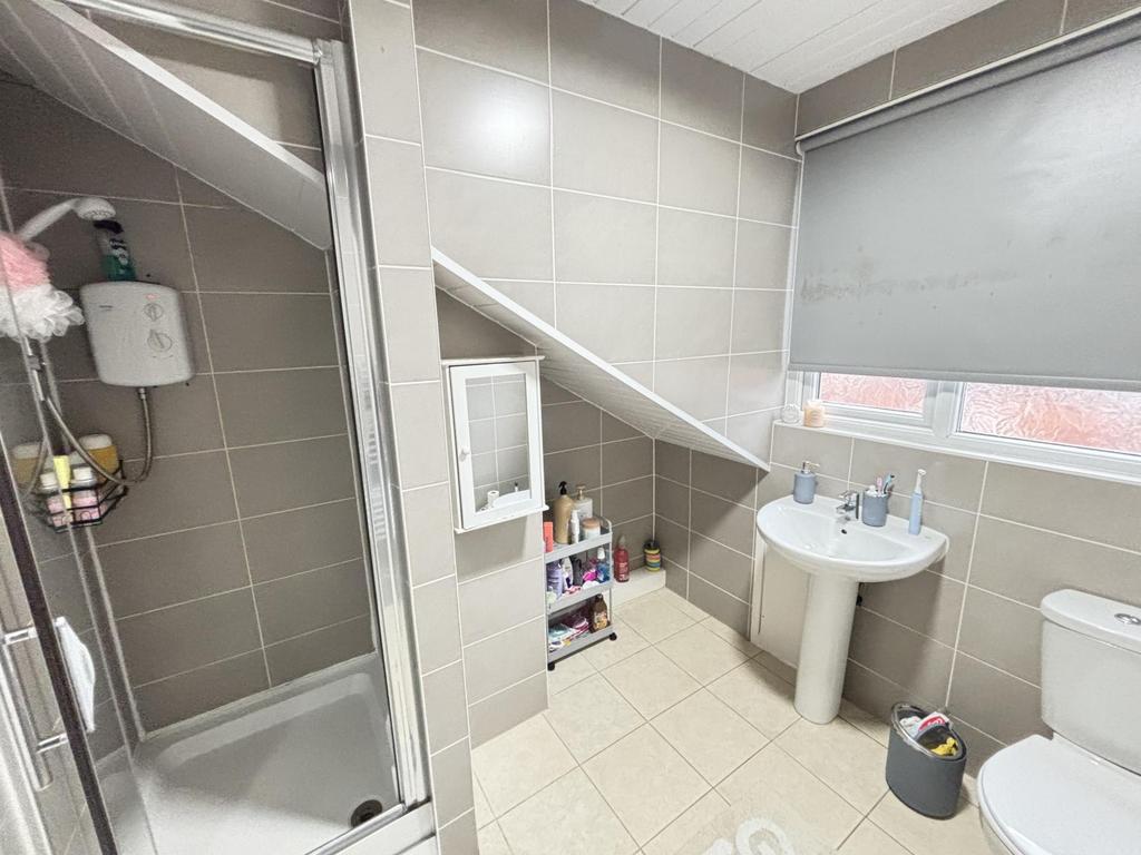 Bright and well-maintained bathroom with a larg...
