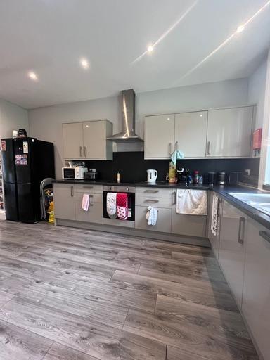 Modern and spacious living area with large wind...