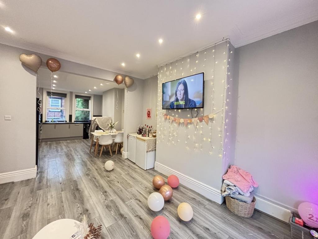 A bright and modern living room featuring a lar...