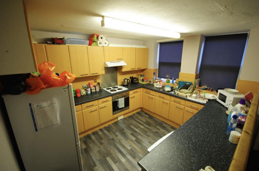 A well-lit kitchen with ample counter space and...