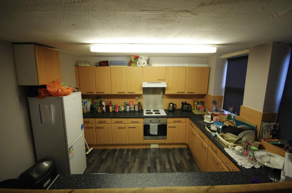 Modern kitchen with ample counter space and nat...