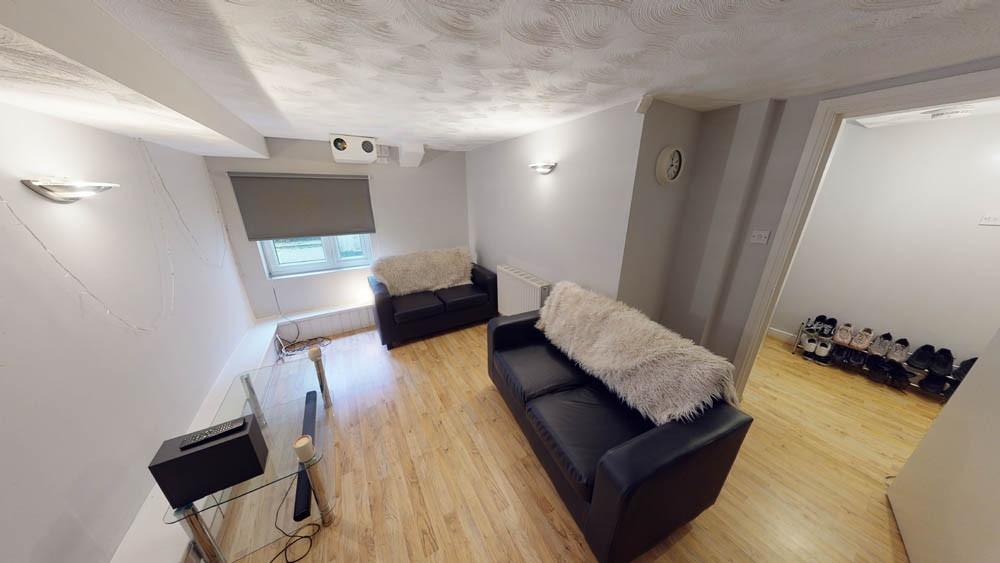 A spacious and inviting living room with ample ...