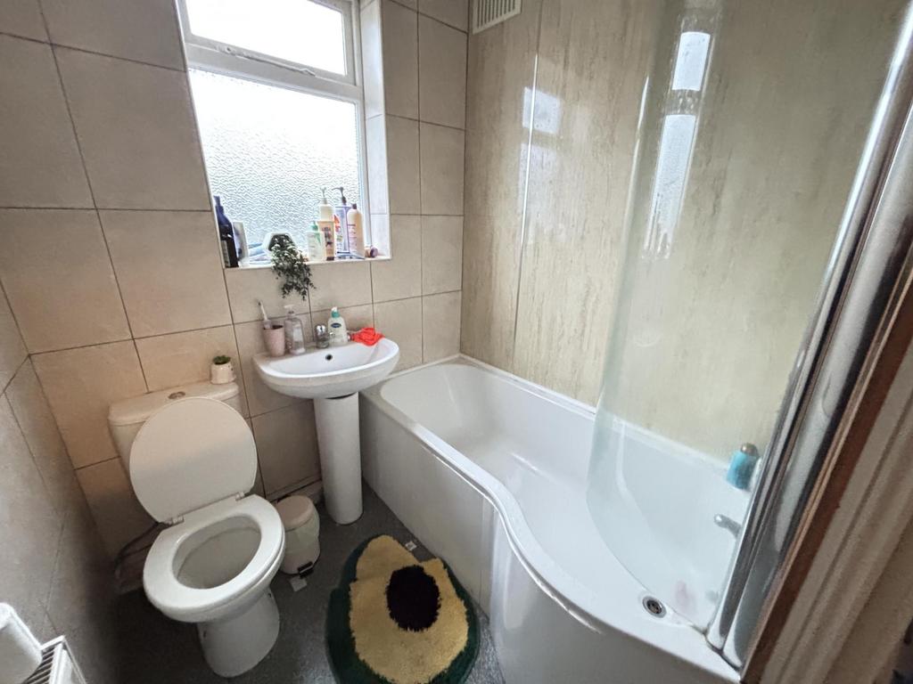 A clean and well-maintained bathroom with a spa...
