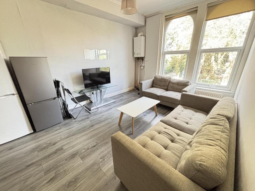 A bright and spacious living room featuring mod...