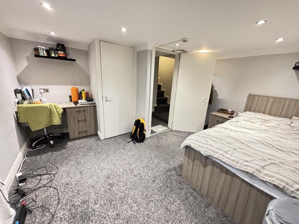 A well-maintained bedroom featuring a comfortab...