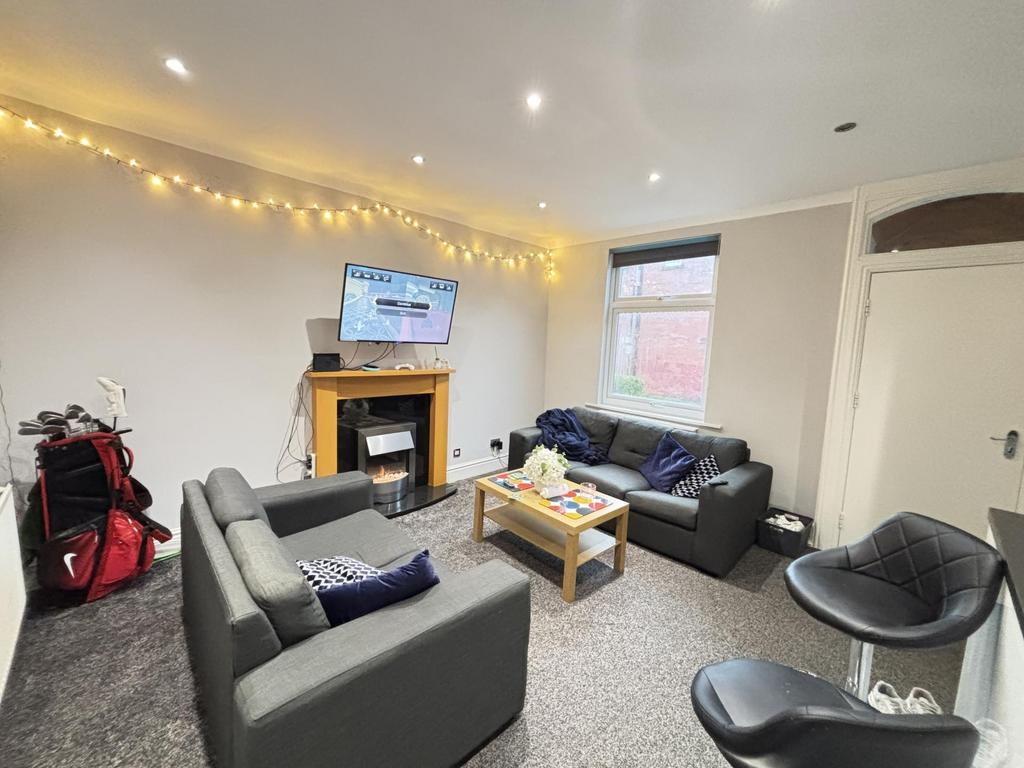 A spacious and well-lit contemporary living roo...