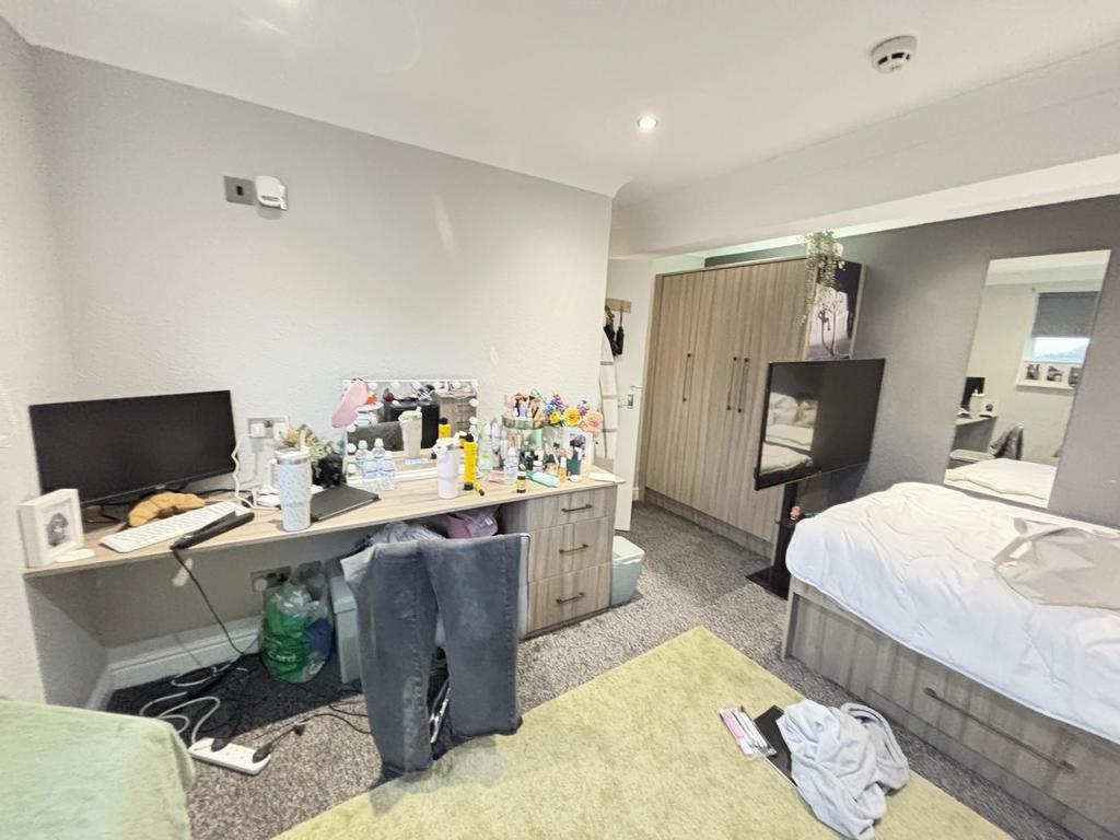 Bright and well-maintained bedroom featuring a ...