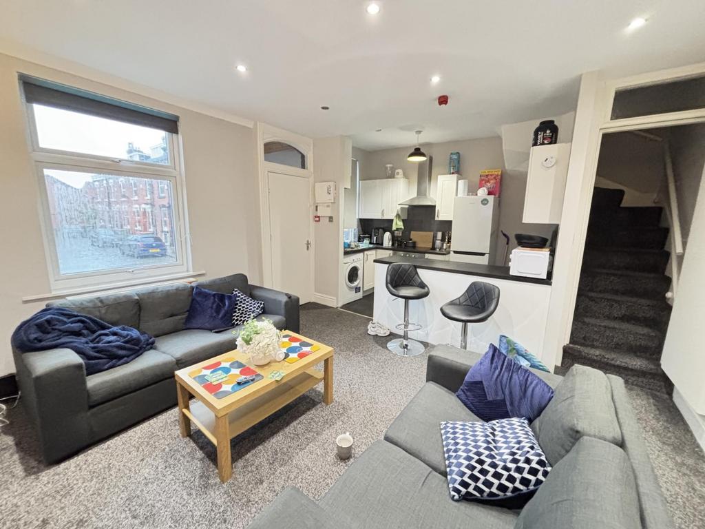 Bright and welcoming living room featuring a la...