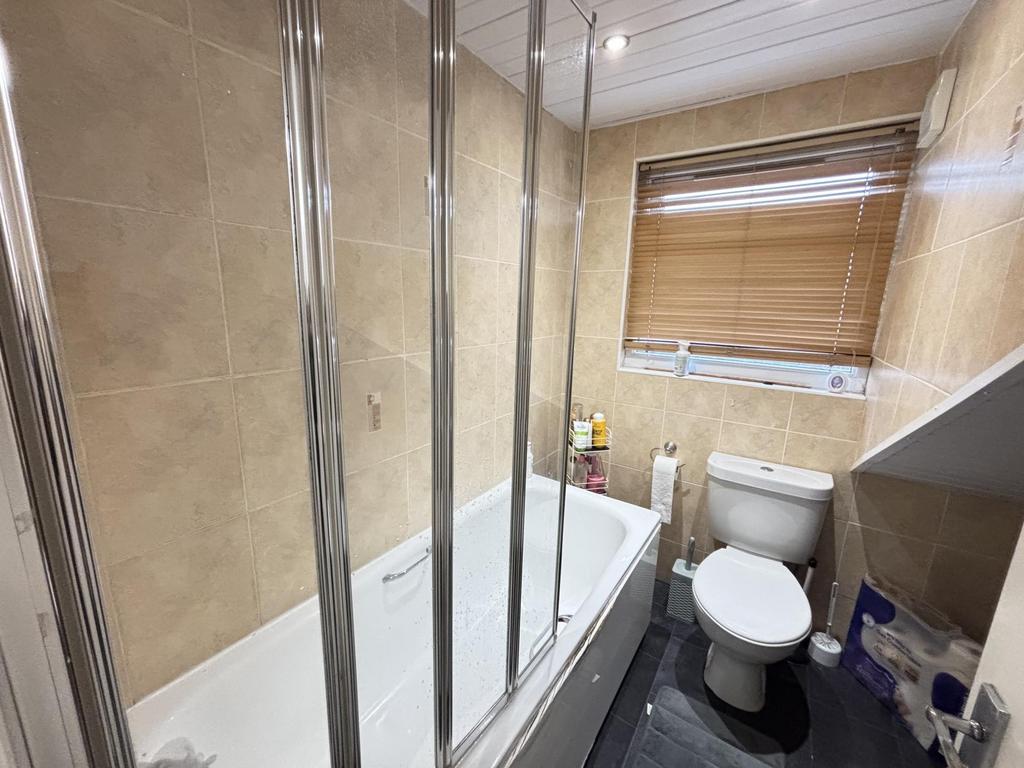 A clean and well-maintained bathroom featuring ...