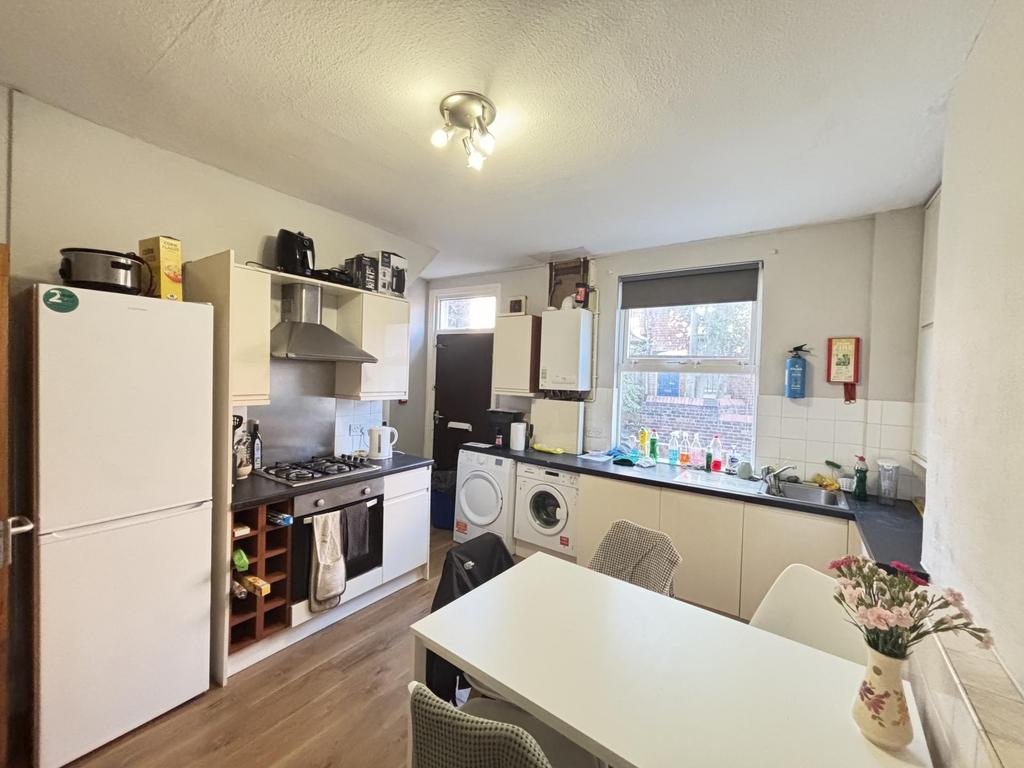 Bright and functional kitchen with ample natura...