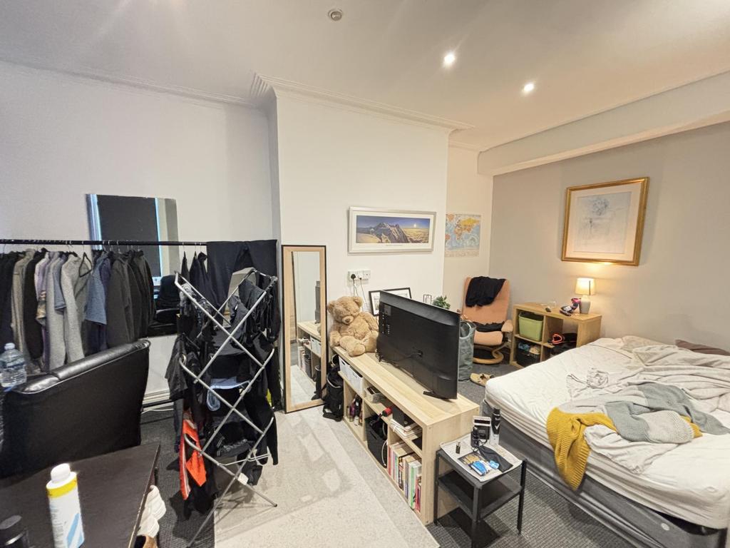 A spacious and modern living room with ample na...