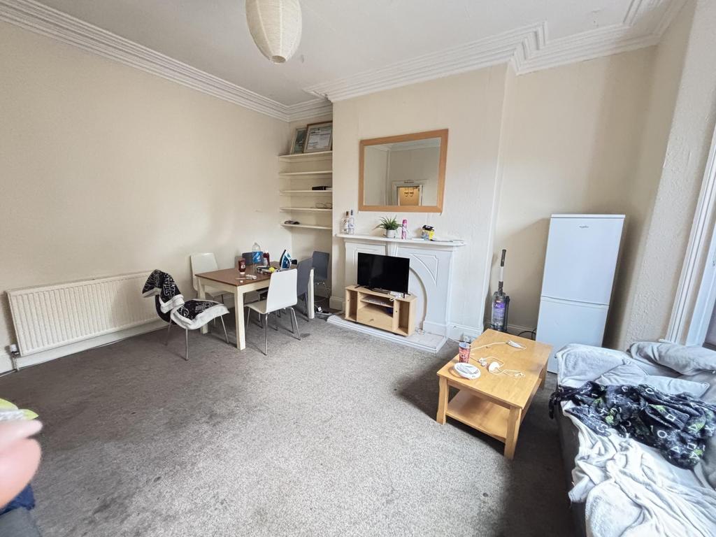 A spacious and well-lit contemporary living roo...