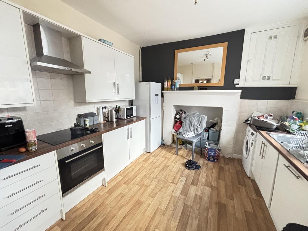 A bright, modern kitchen with ample storage and...