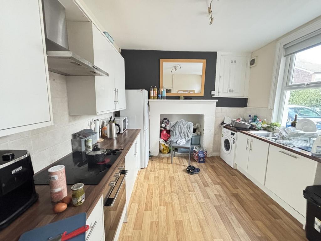 Bright and functional kitchen with ample counte...