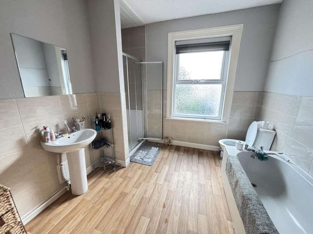 Bright and well-maintained bathroom featuring a...