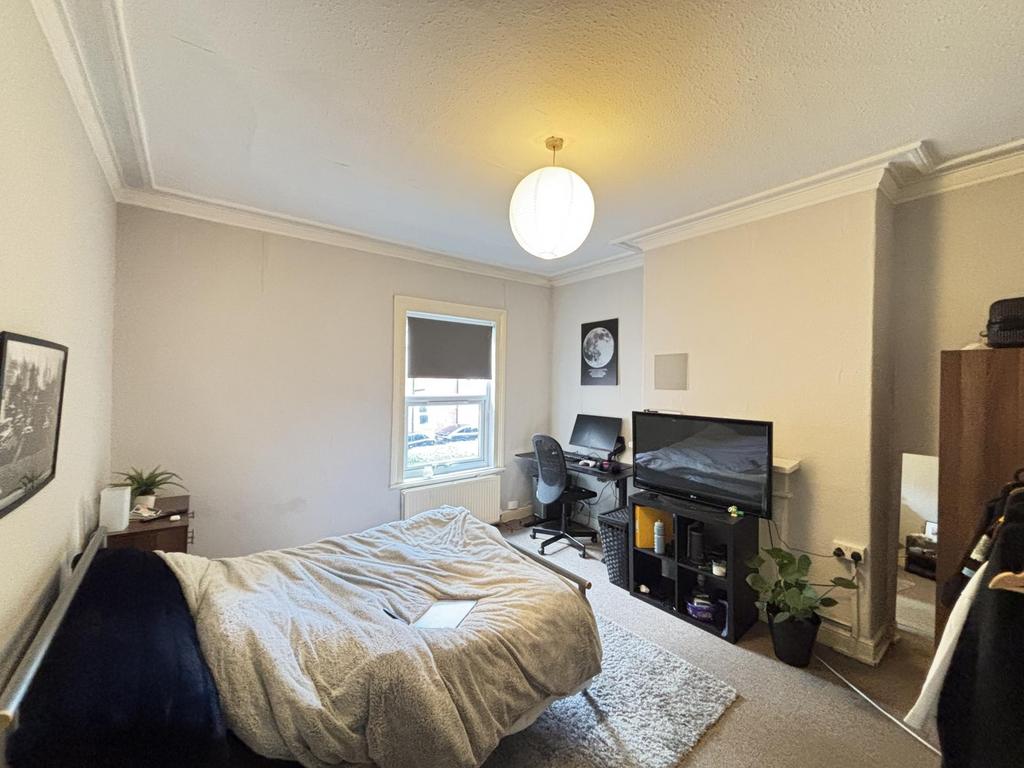 A bright and welcoming living room featuring a ...