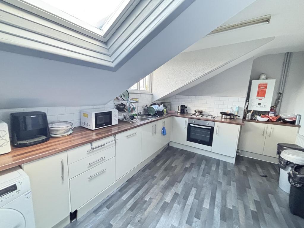 A bright, modern kitchen with ample natural lig...