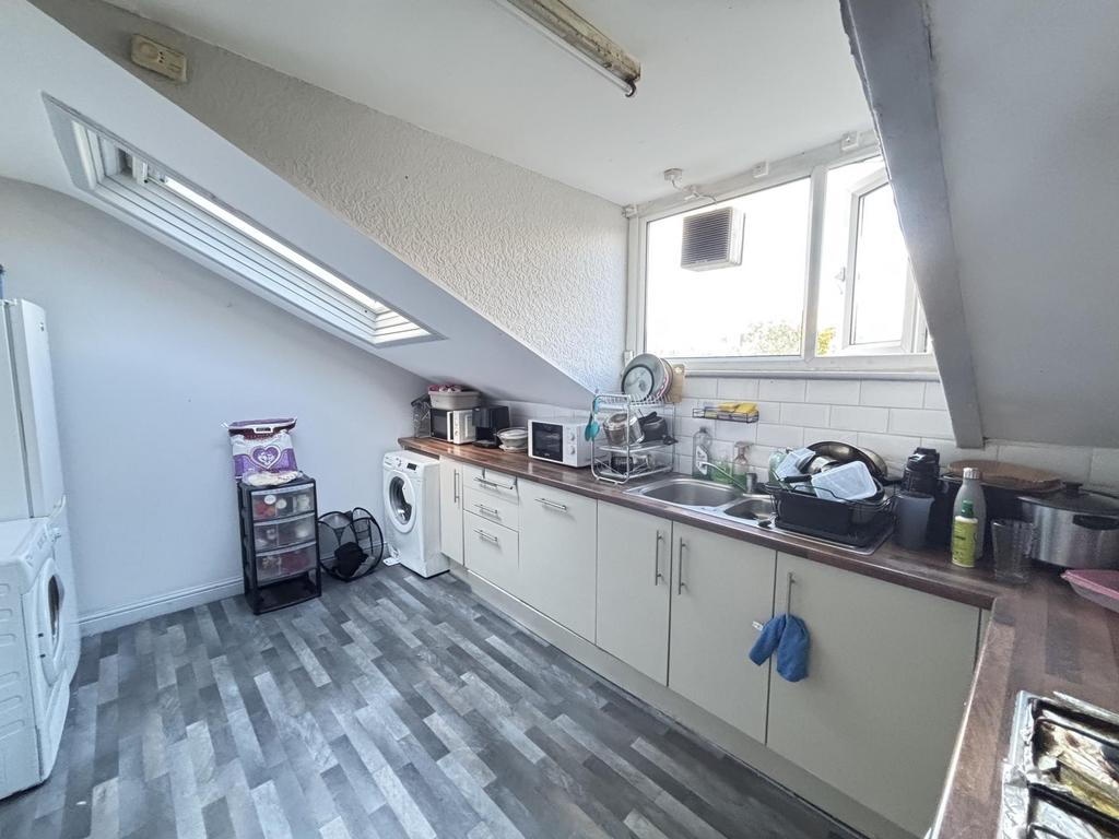 Bright and well-maintained kitchen area with am...