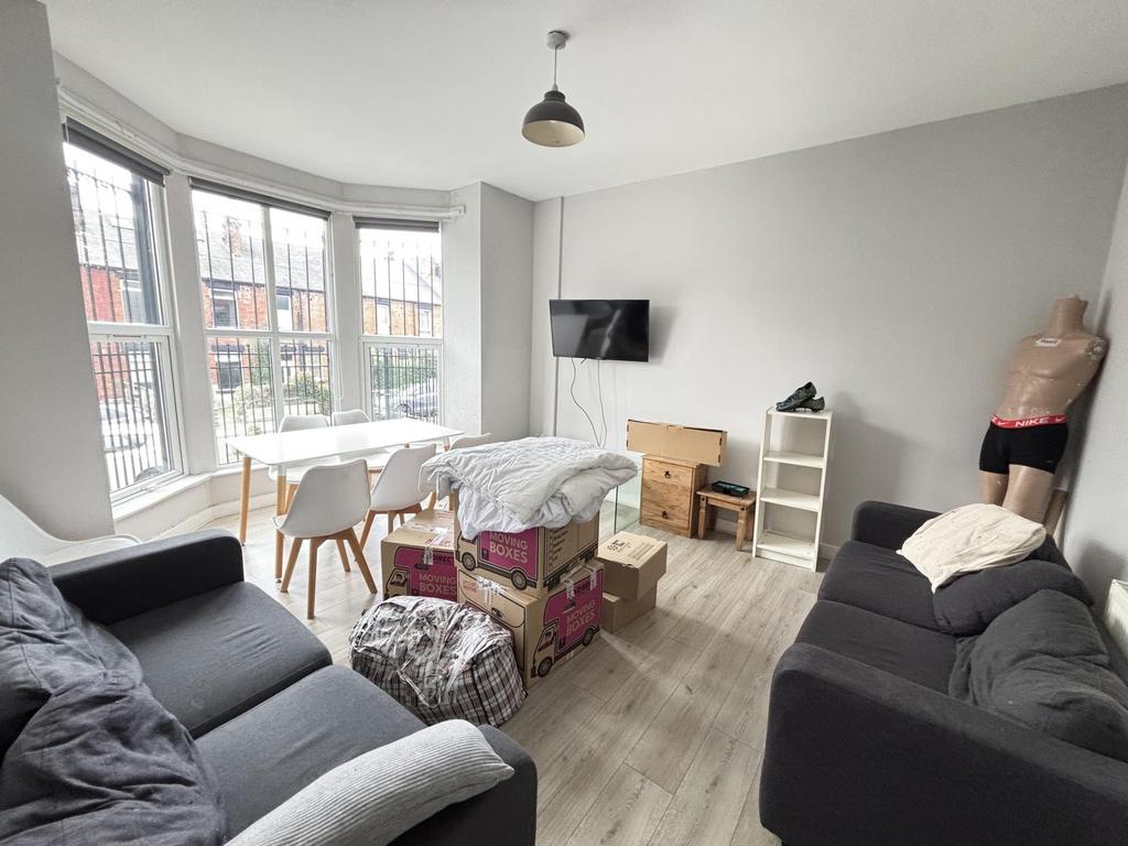 A bright and inviting living room with large wi...