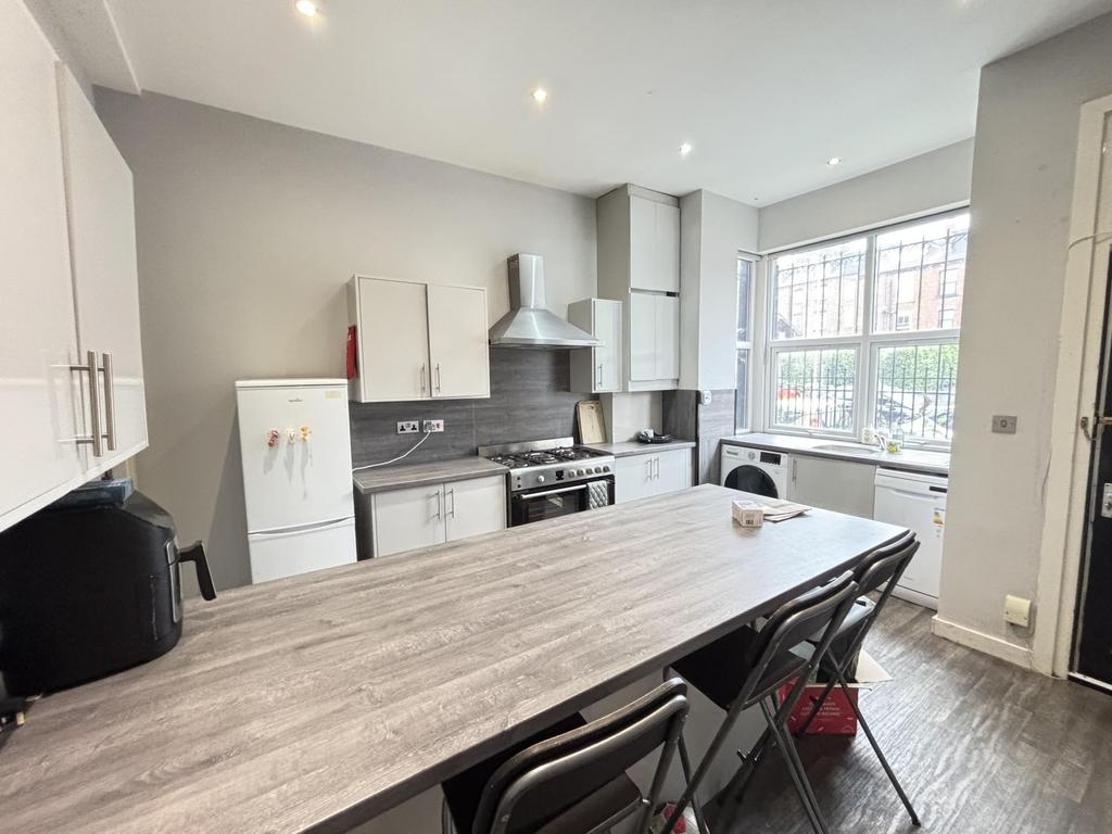 A bright and modern kitchen with ample natural ...
