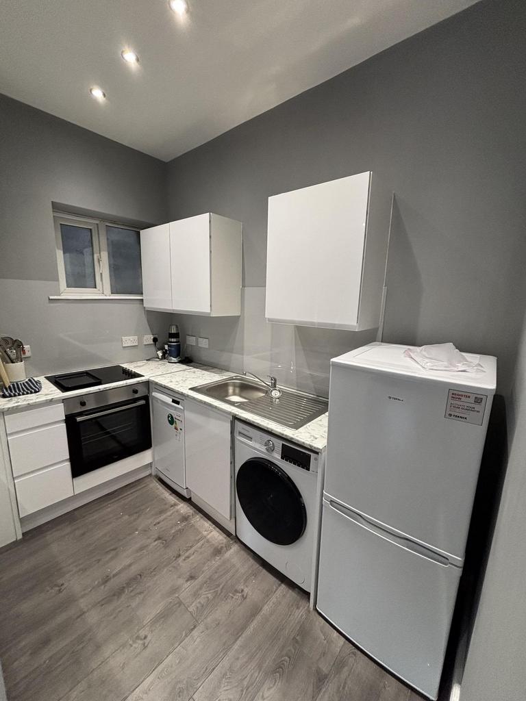 Modern, well-maintained kitchen area featuring ...