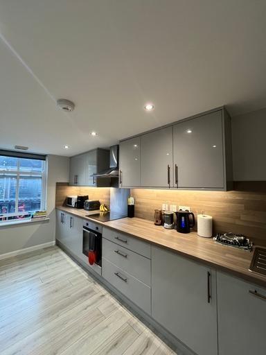 Modern, well-organized kitchen with ample stora...