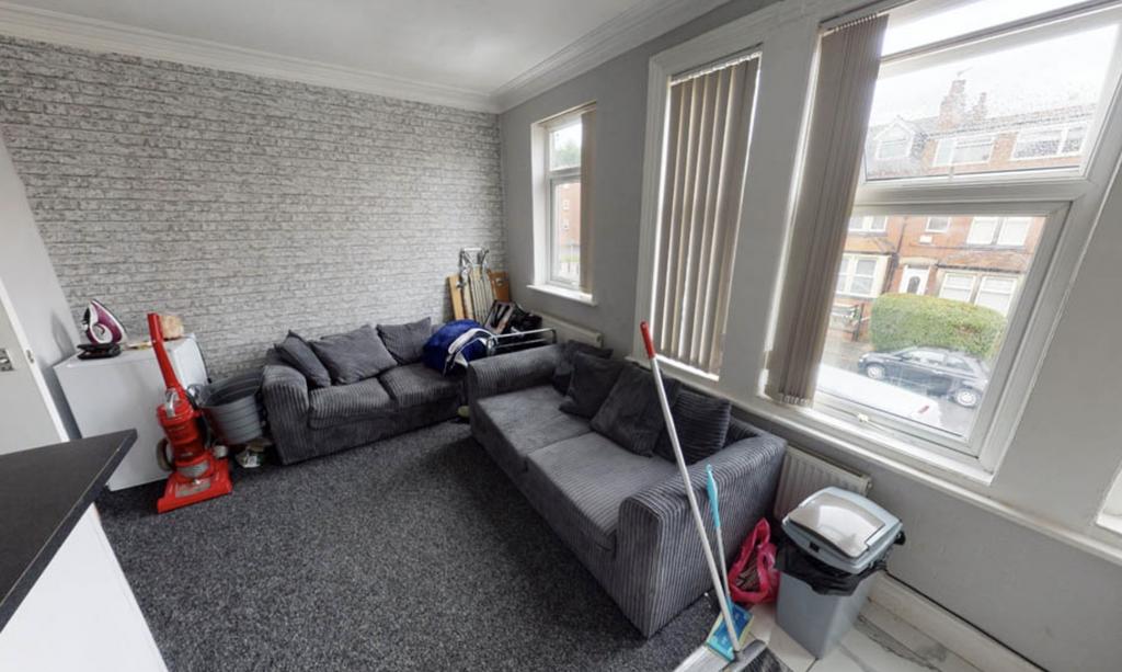 Bright and spacious living room featuring a mod...
