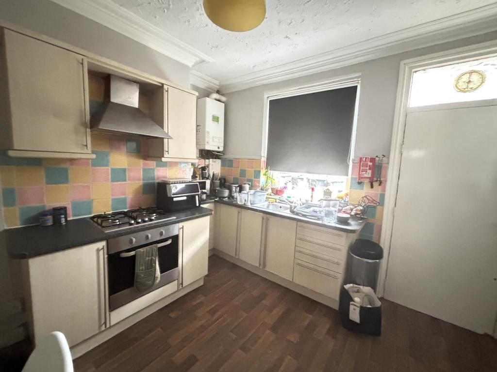 Bright and welcoming kitchen with ample counter...