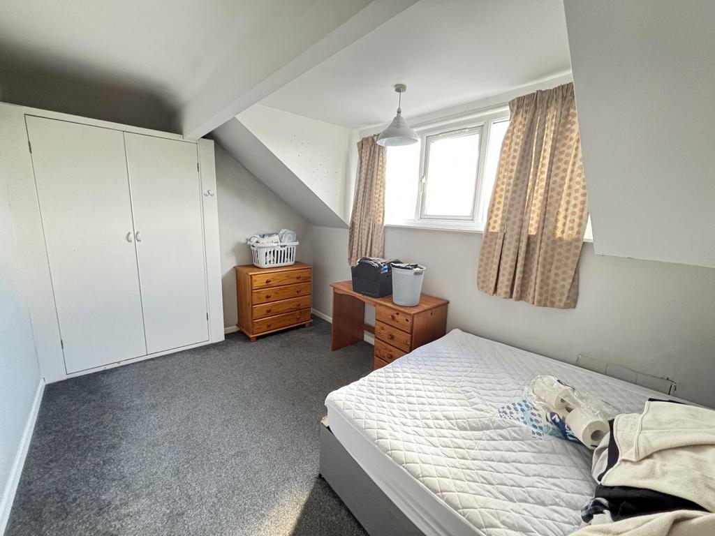 A bright and spacious master bedroom featuring ...