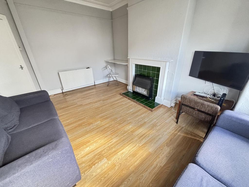A bright and welcoming living room featuring a ...