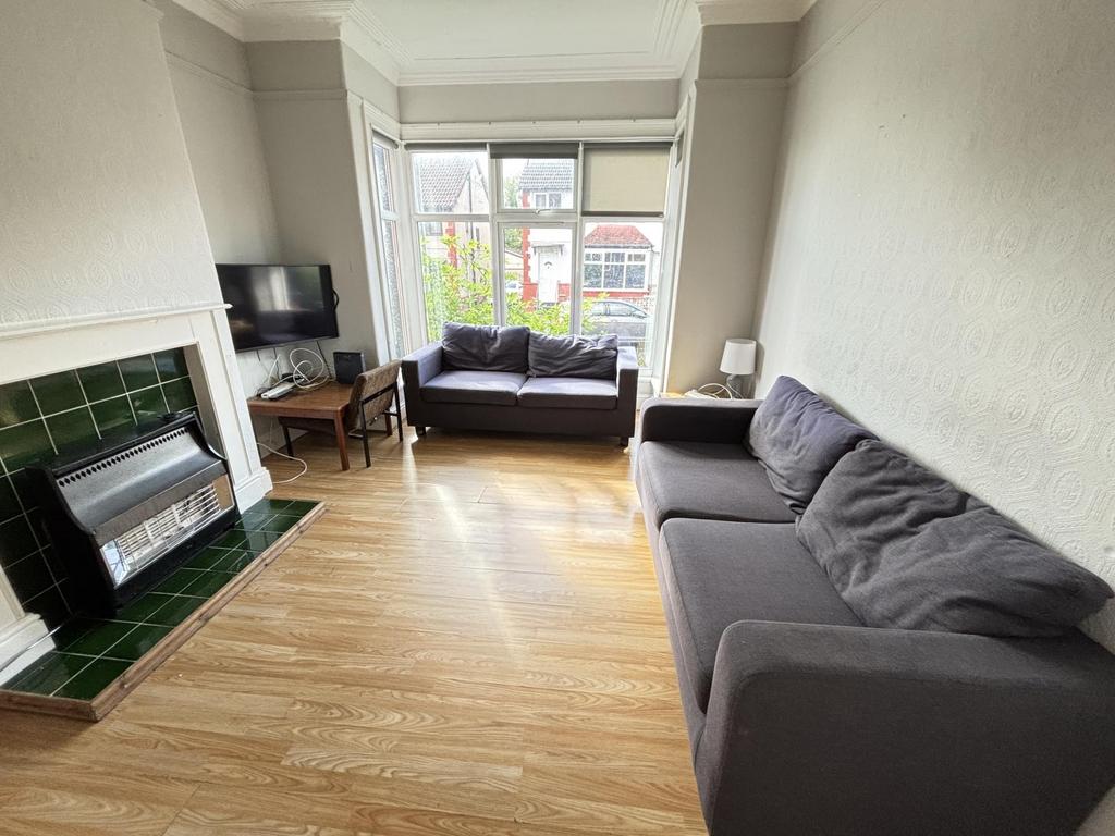 Bright and welcoming living room featuring a la...