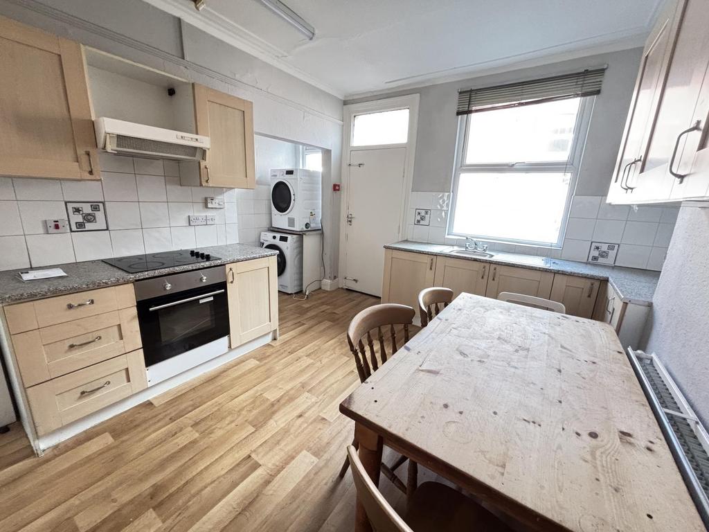 Bright and well-maintained kitchen with ample n...