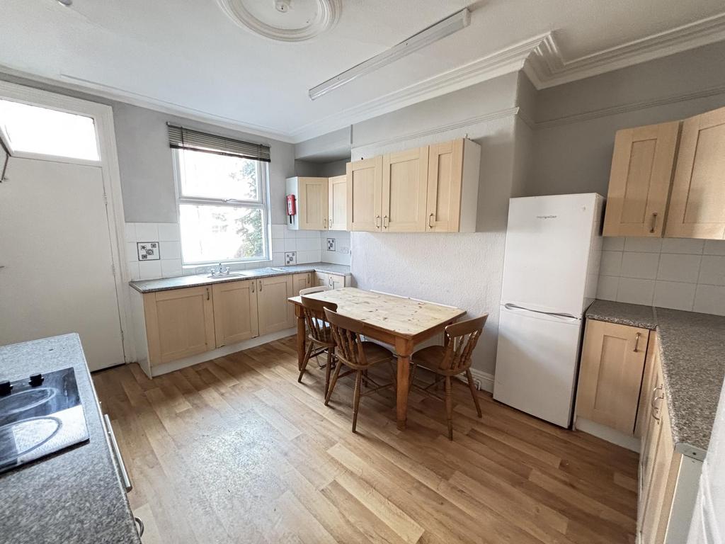 Bright and spacious kitchen with ample natural ...