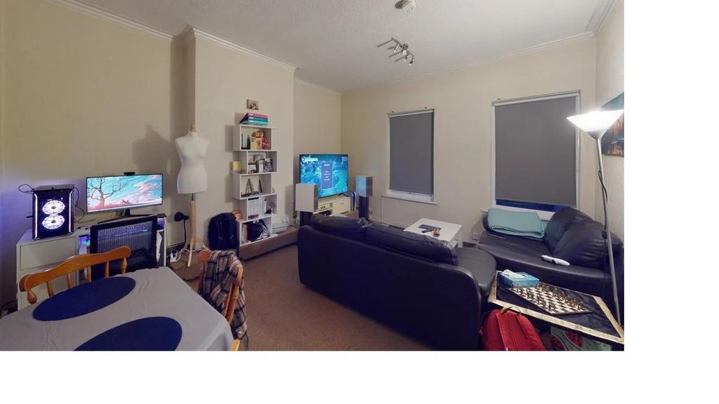 A cozy living room featuring a comfortable sofa...